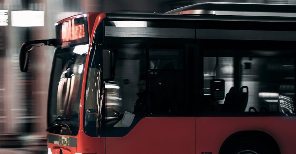 Capture of a city bus moving at night with blurred background, illustrating urban transportation.